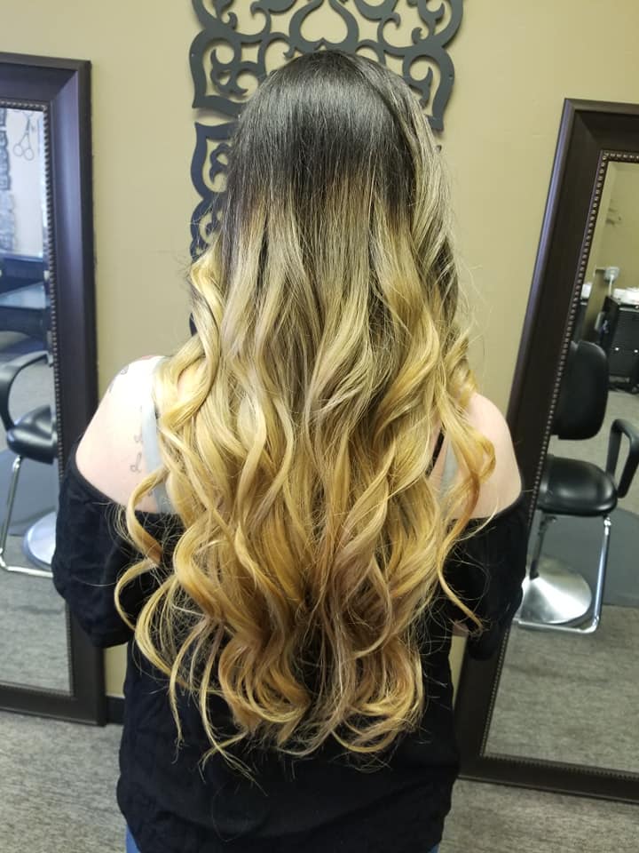 Long blonde balayage with soft curls