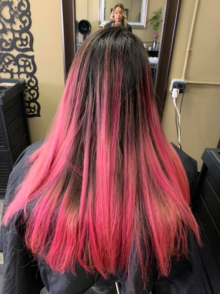 Sleek straight hair with bold pink highlights